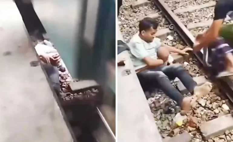 El abrazo que los salvó padre protege a su hijo del tren